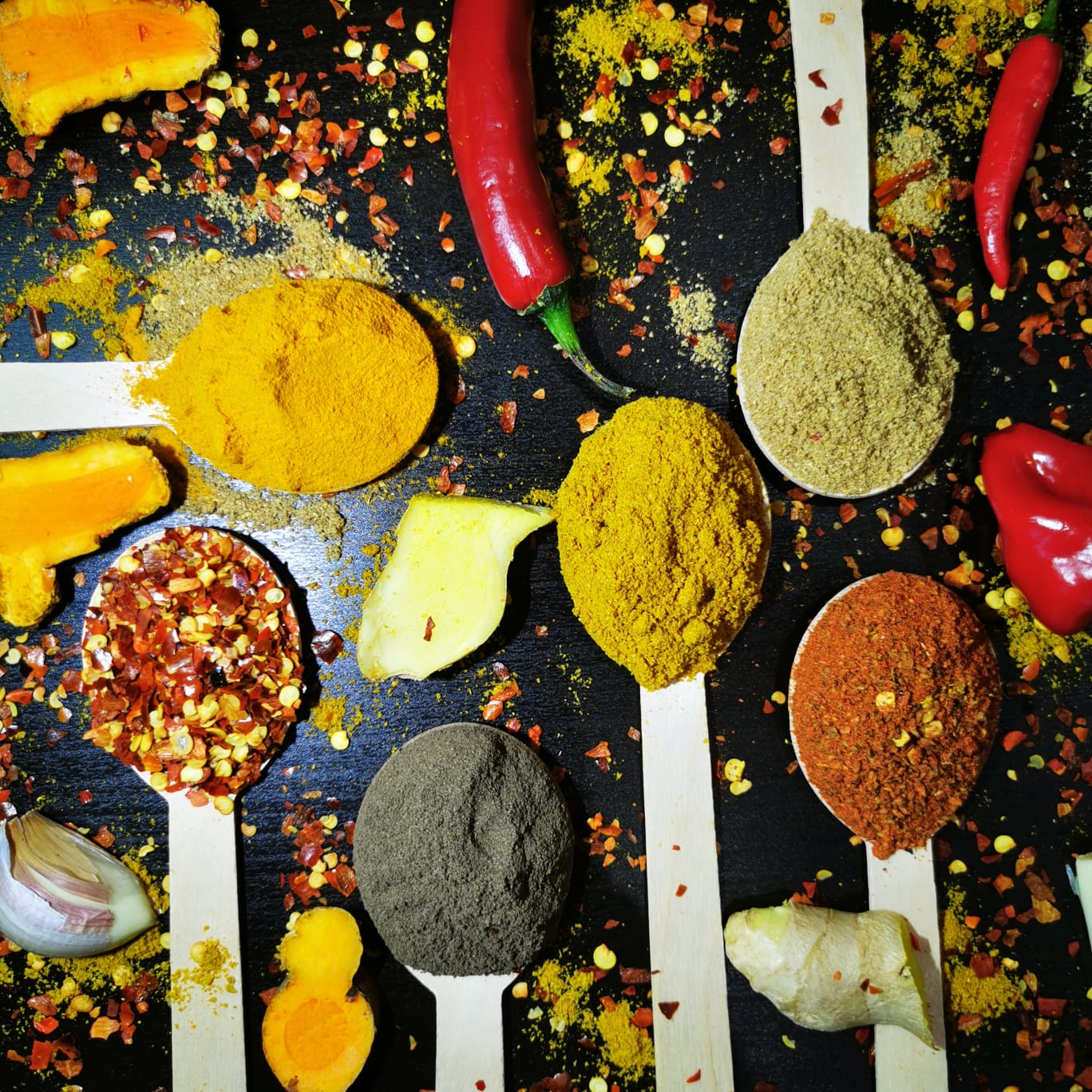 Mixed ground spices with fresh chili, ginger and turmeric